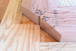 Showing redwood bases in jig from the interior corner interface