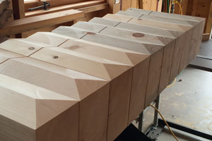 Milled white pine beam extensions for column base