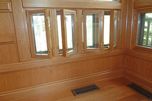 Old casement style windows in opened and closed positions