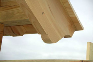 Verge beam tail at lower gable cornice